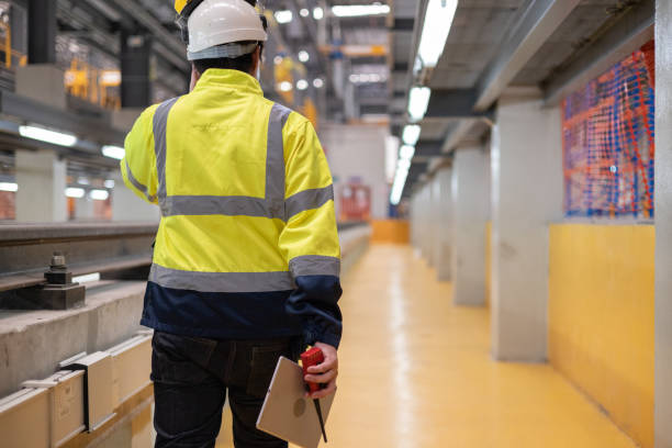istock Project  Engineer train Inspect the train's diesel engine, railway track in depot of train 1478628265