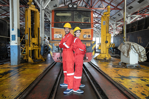 Engineer train Inspect the train's diesel engine, railway track in depot of train
