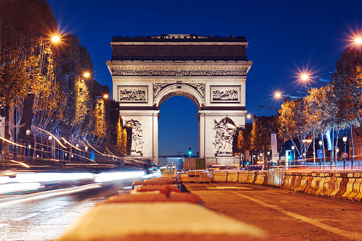Triumphal Arch of the Star at night. Construction work. Long exposures hot. Paris, France