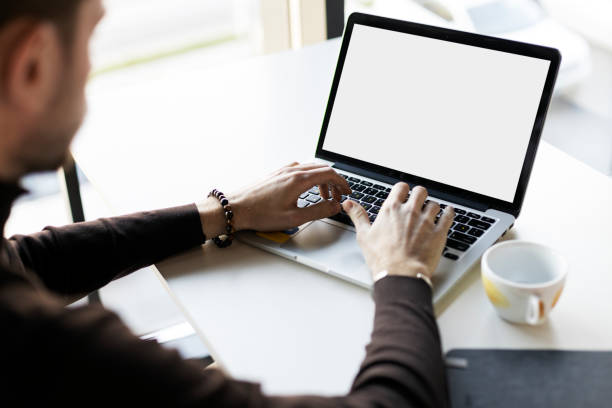 istock Freelancer worker using laptop, tipping, working on online project, sitting at workplace 1478639404