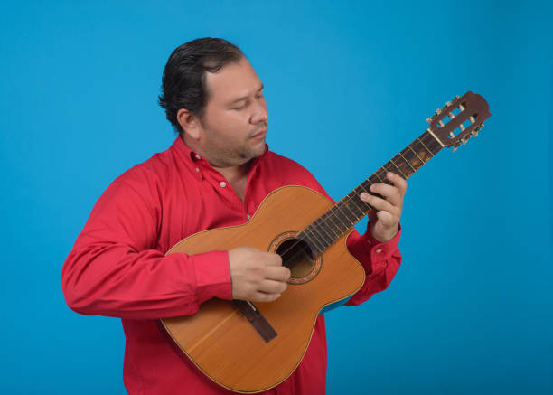 istock Studio portrait of a man playing an old Cuban tres. 1478642661