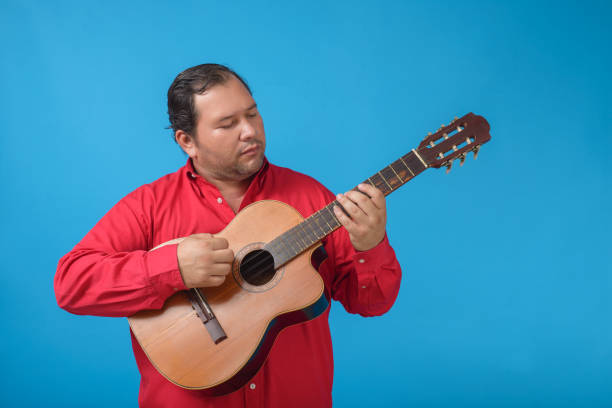 istock Studio portrait of a man playing an old Cuban tres. 1478642670
