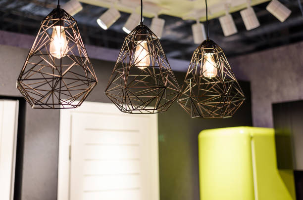 istock Big incandescent light bulbs with metal chandelier 1478643811