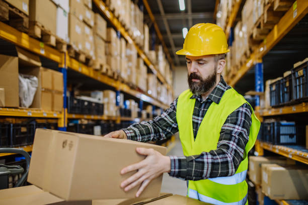 istock Warehouse worker stocking goods in a warehouse. 1478646262