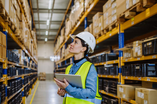 istock Warehouse female worker checking up stuff in a warehouse. 1478646326