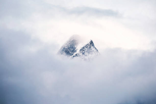 istock Switzerland mountains covered in snow through clouds 1478648174
