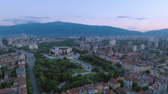 Wide drone shot of National Palace of culture, Sofia, Bulgaria. Aerial view of Sofia downtown area, fountains and water