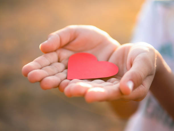 istock Male hands holding a red heart 1478656941