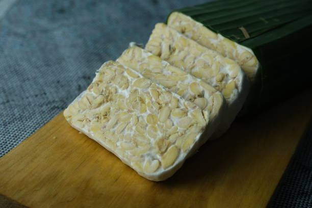 istock Slices of raw tempeh on cutting board 1478660667