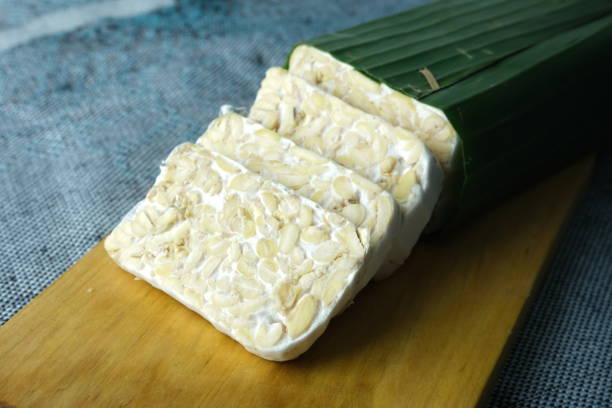 istock Slices of raw tempeh on cutting board 1478660670