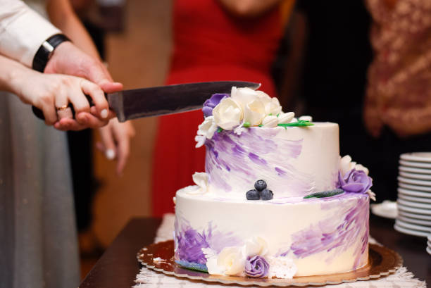 istock A couple slicing a cake at wedding 1478662299