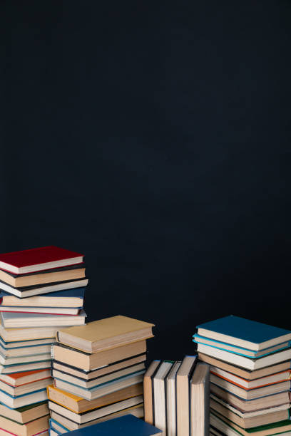 istock large number of books stacked on a black background in the library science knowledge 1478663898