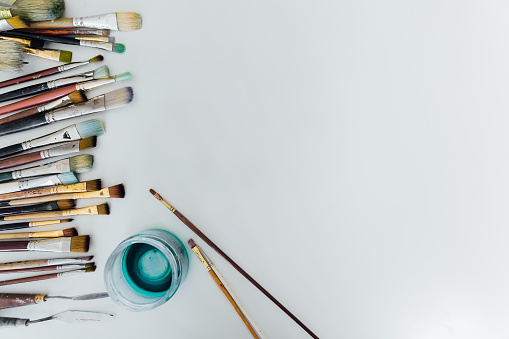 brushes for drawing on white sheet of paper artist