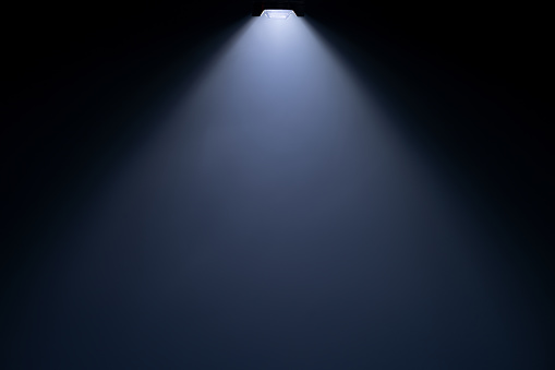 Close up of light beam isolated on black background with copy space