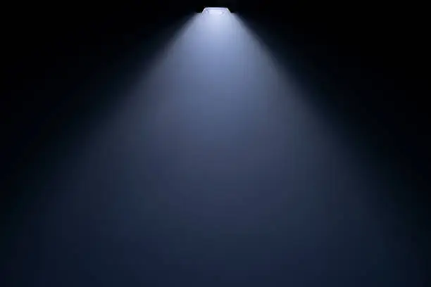 Photo of Close up of light beam isolated on black