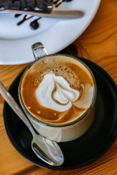 istock Cup of hot coffee on wooden table 1478673355