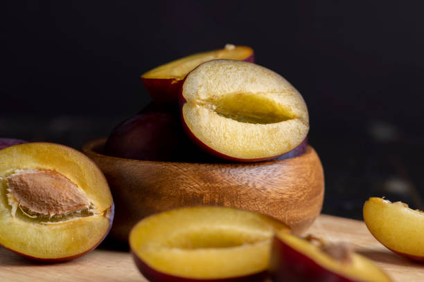 istock Ripe plums cut into pieces during cooking 1478681660