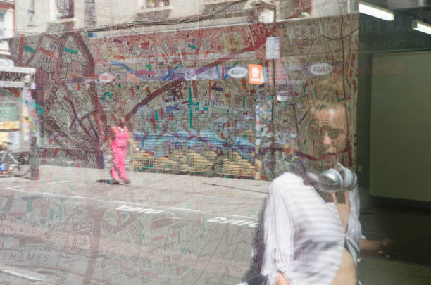 Young woman with bandana is holding aerosol can of spray paint