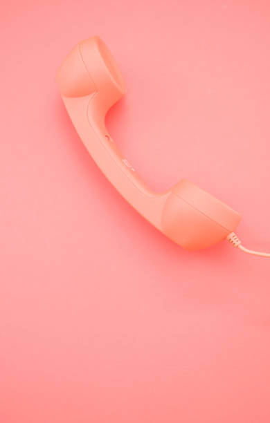istock Vertical shot of a classic handset on pastel pink background for a copy space 1478690203