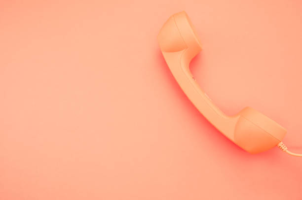istock Classic handset on pastel orange background for a copy space 1478690204