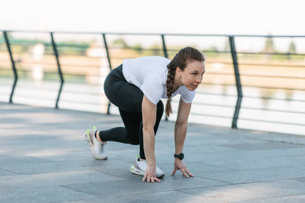 istock Woman in Sprinter Stance, Ready to Run 1478692487