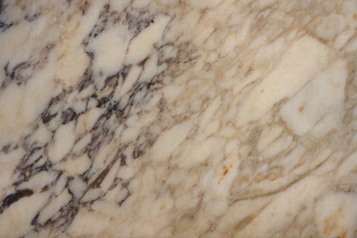 Cream color marble textured background with copy space
