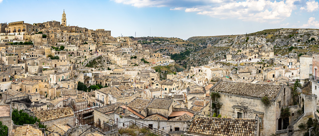 Panoramic view of the historic district of Sasso Caveoso in Matera with the Gravina ravine in the background, Basilicata, Italy
