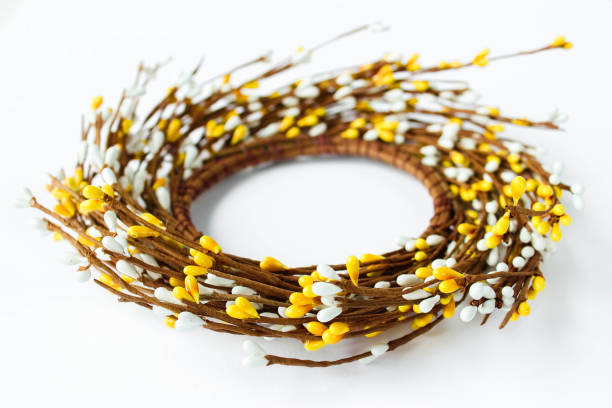 istock Minimal Easter composition with place for text. Concept of creative arrangement made of blossoming twigs. Handcraft Easter wreath made from twigs isolated on white background 1478702586