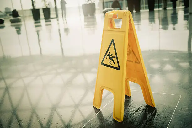 Photo of Yellow slippery warning sign
