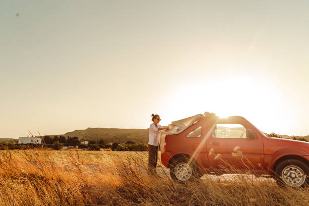 istock Young woman packing for a road trip 1478707489