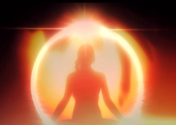 istock 3d illustration of meditating woman silhouette with light effects 1478712875
