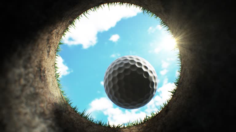 Golf Ball Putting into the Hole Beautiful 3d Animation. Golf Ball Falling Down Towards Camera Inside Hole on Golf Course After Accurate Shot in Slow Motion Close-up. Sport Concept