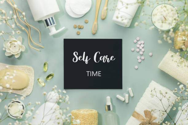 istock Beauty products on blue background with chalkboard with text Self Care Tim 1478714447