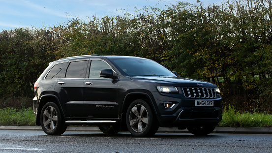 Stony Stratford,Bucks,UK - November 20th 2022. 2014 diesel Jeep Grand Cherokee travelling on an English country road