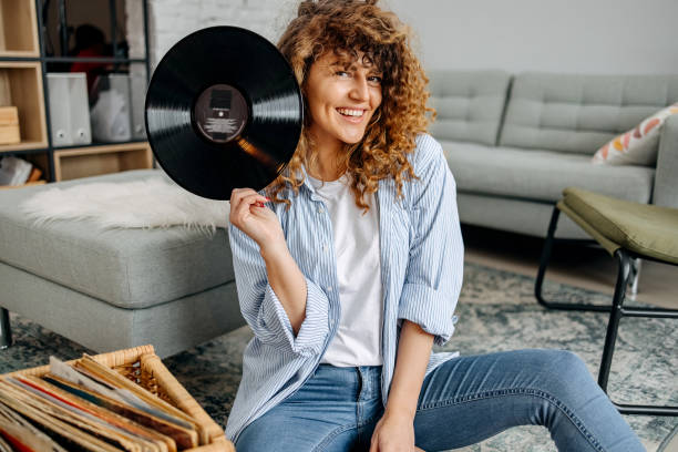 istock Woman with old vinyl record 1478718717