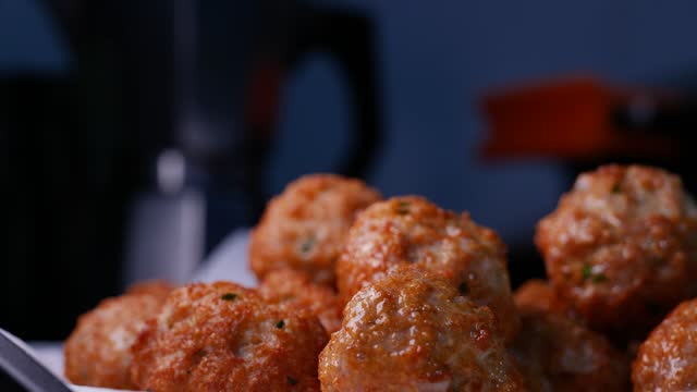 Selective focus view of tasty meatballs on the plate in 4K