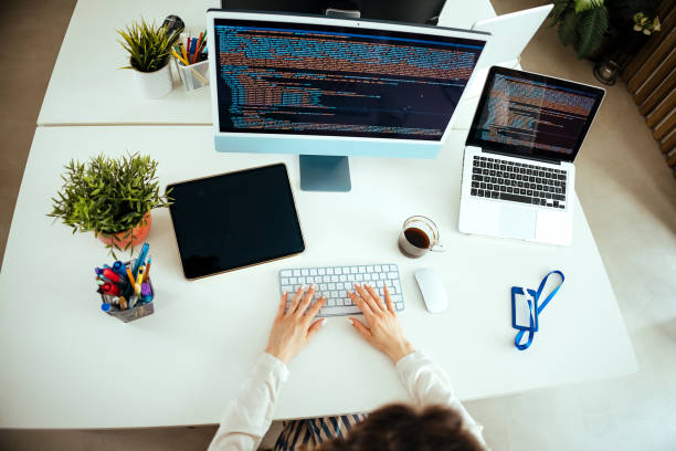 istock Young woman programming at her home office 1478719288