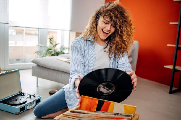 Smiling girl holding vinyl record