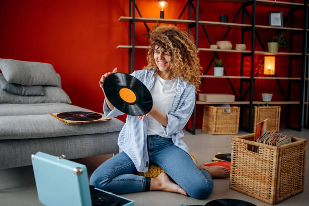 istock Smiling girl holding vinyl record 1478720066