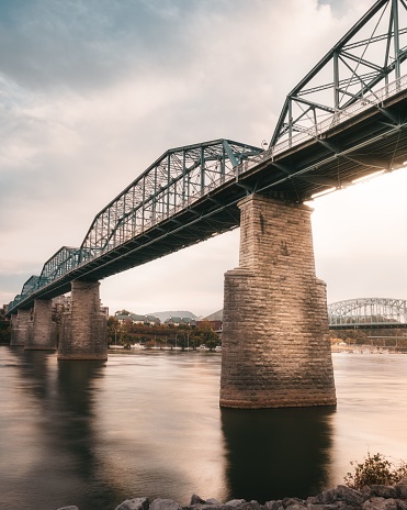 A vertical shot of Walnut Street Bridge under cloudy sky in Chattanooga, Tennessee, USA