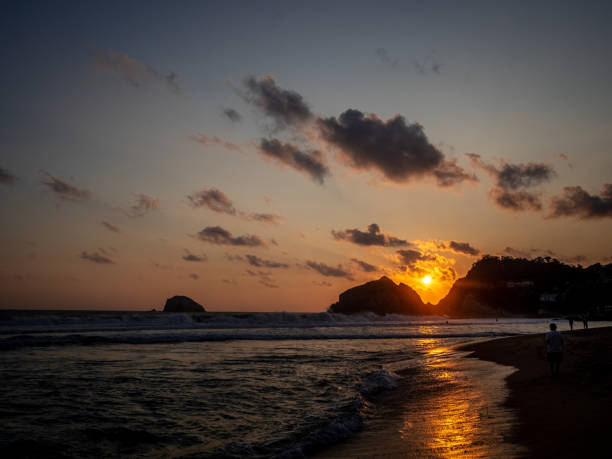 istock Sunset over the sea with mountains in the background 1478722454