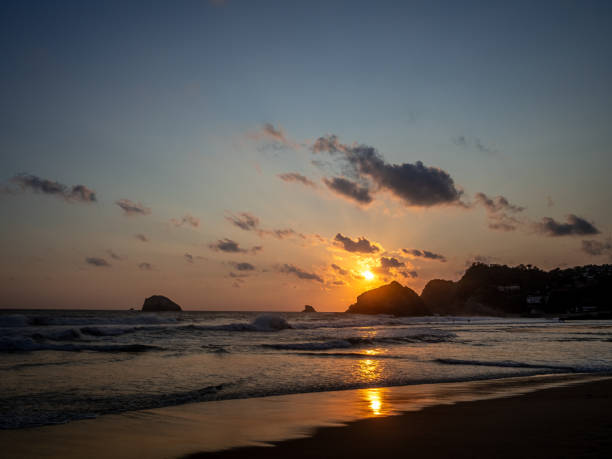 istock Sunset over the sea with mountains in the background 1478722470