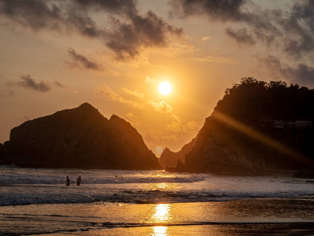 istock Sunset over the sea with mountains in the background 1478722916