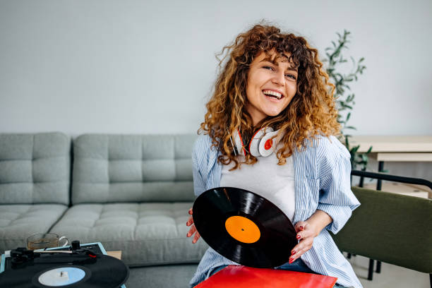 istock Woman with old vinyl record 1478722929
