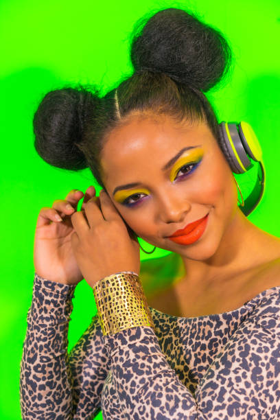 lovely smiling hipste girl with bright makeup and two tails hairstyle enjoying music with headphones - head and shoulders audio imagens e fotografias de stock