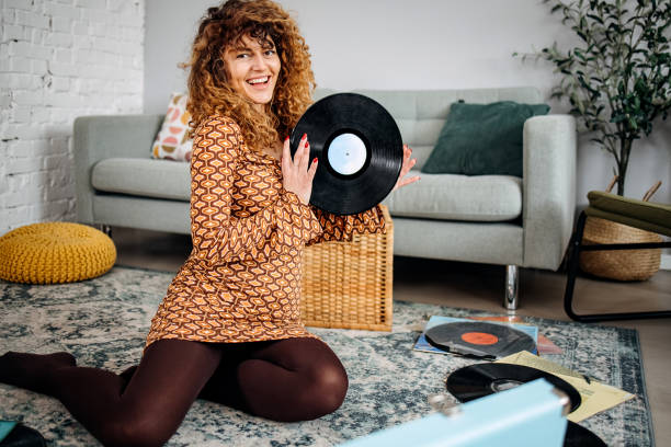 istock Woman with old vinyl record 1478724943