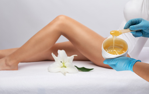 Elos epilation hair removal procedure on a womans body. Beautician doing laser rejuvenation in a beauty salon. Removing unwanted body hair. Hardware ipl cosmetology