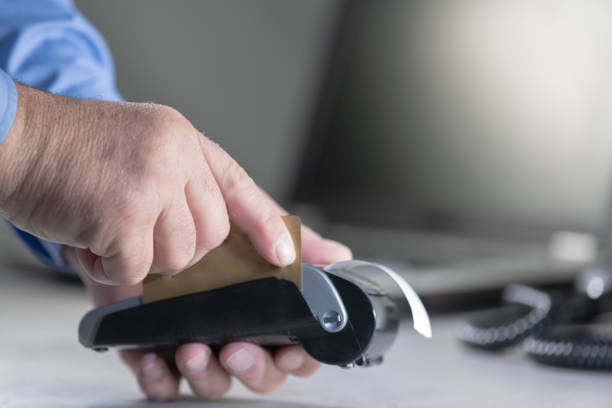istock Selective focus shot of a man's hand paying with a credit card 1478732855