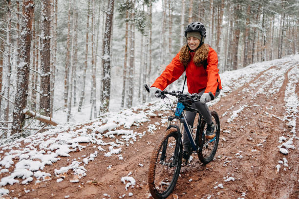 istock Woman rides a bicycle in the forest 1478735969