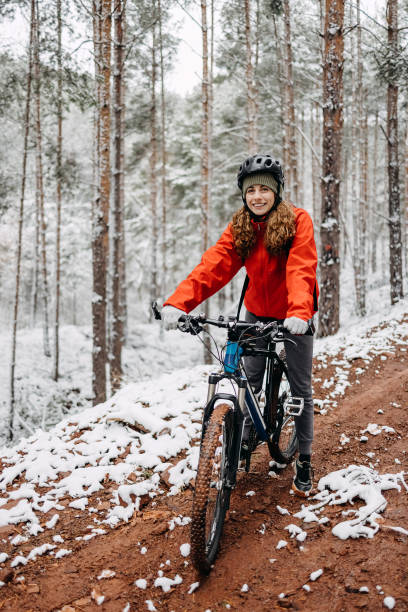 istock Woman rides a bicycle in the forest 1478736395